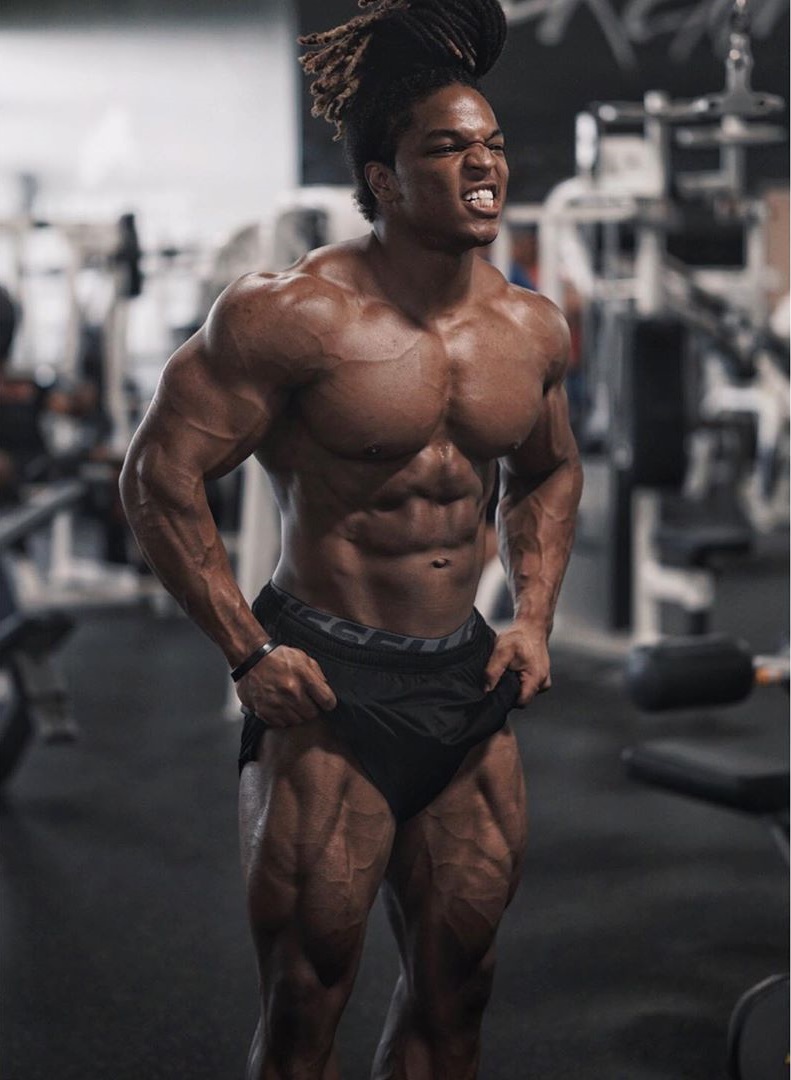 Jay Coss flexing his amazing physique in the gym