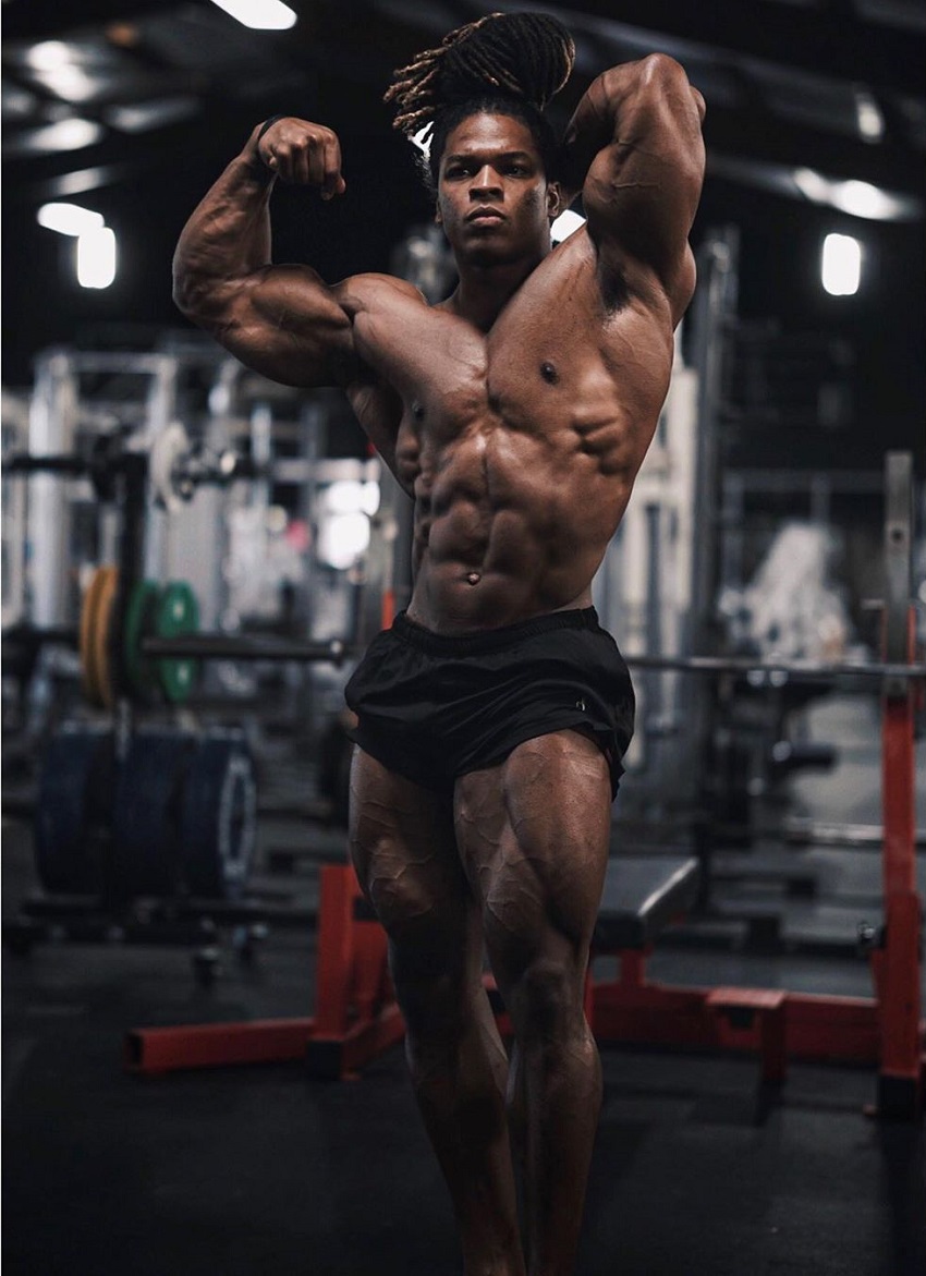 Jay Coss flexing his ripped physique for the ohoto