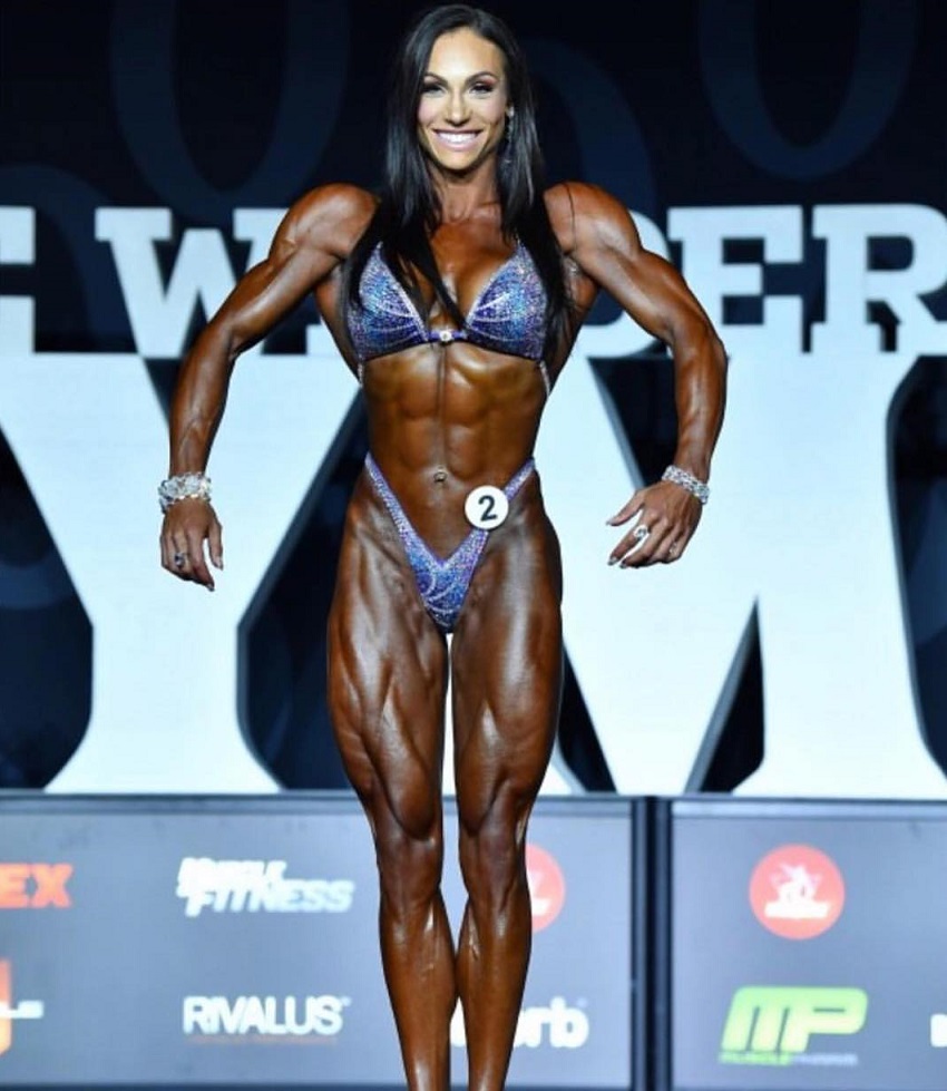 Melissa Bumstead posing on the Joe Weider's Olympia stage