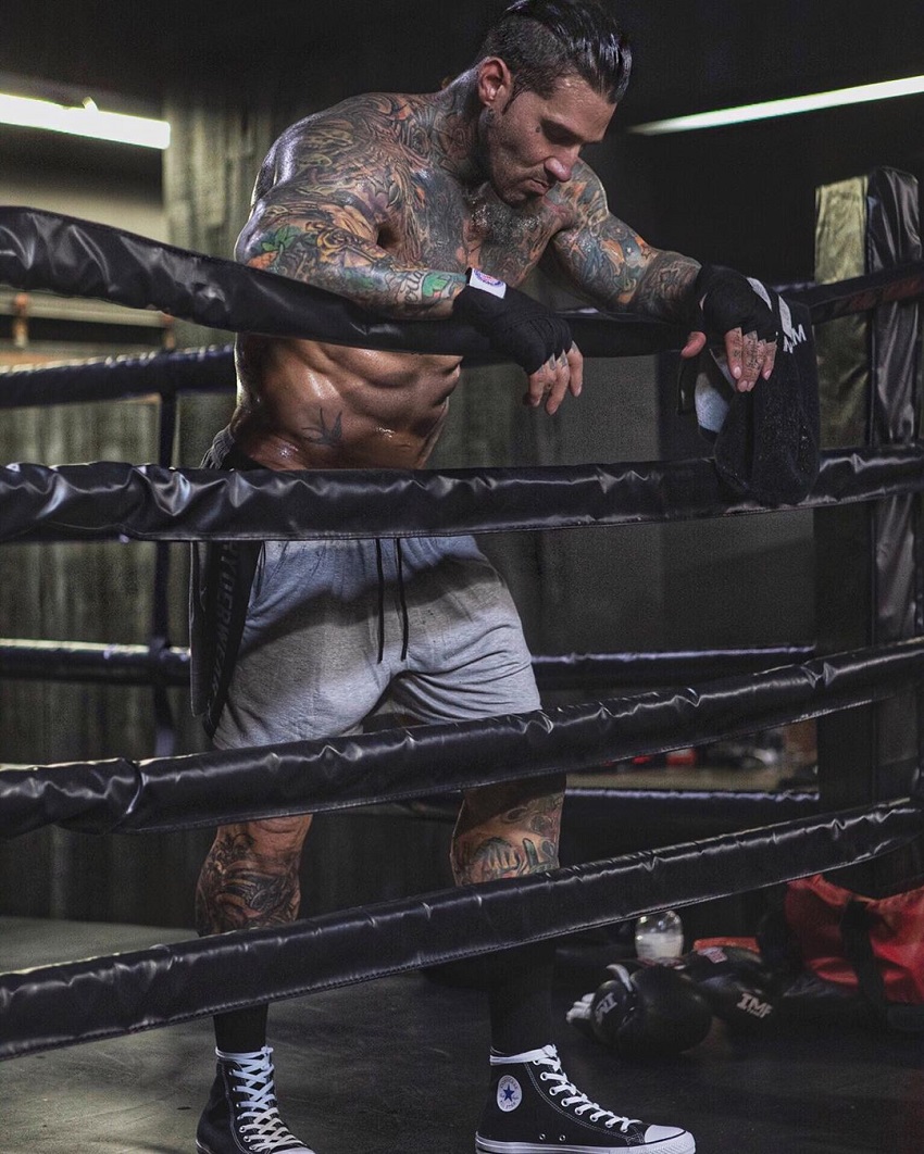 Michael Giovanni Rivera resting on the edge of the boxing ring