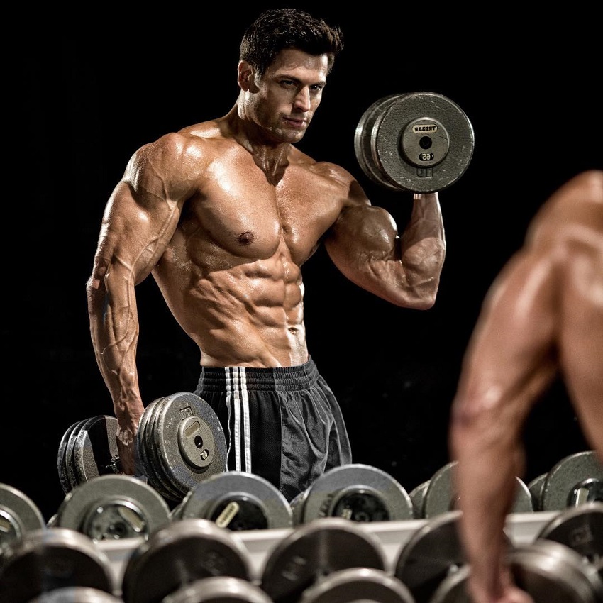 TJ Hoban posing in front of the mirror looking ripped and aesthetic