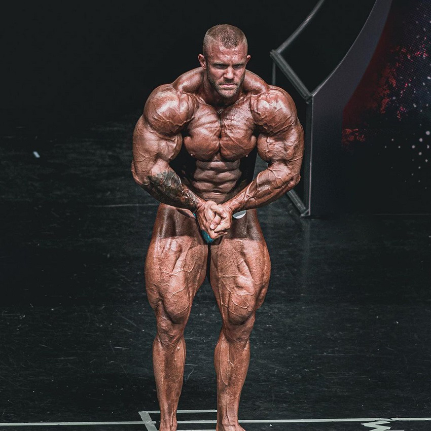 Iain Valliere showing off his most muscular bodybuilding pose in a contest