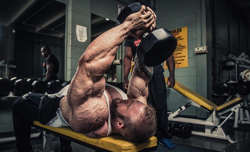 Iain Valliere training his lats lying on a bench