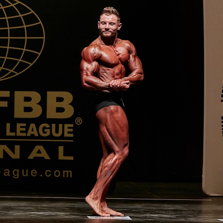 Luke Hulme flexing side chest