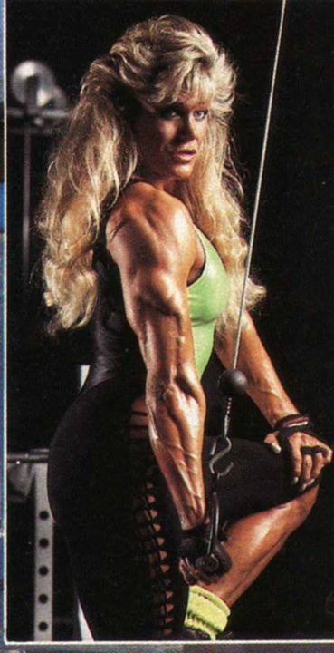 Sandy Riddell flexing her ripped triceps