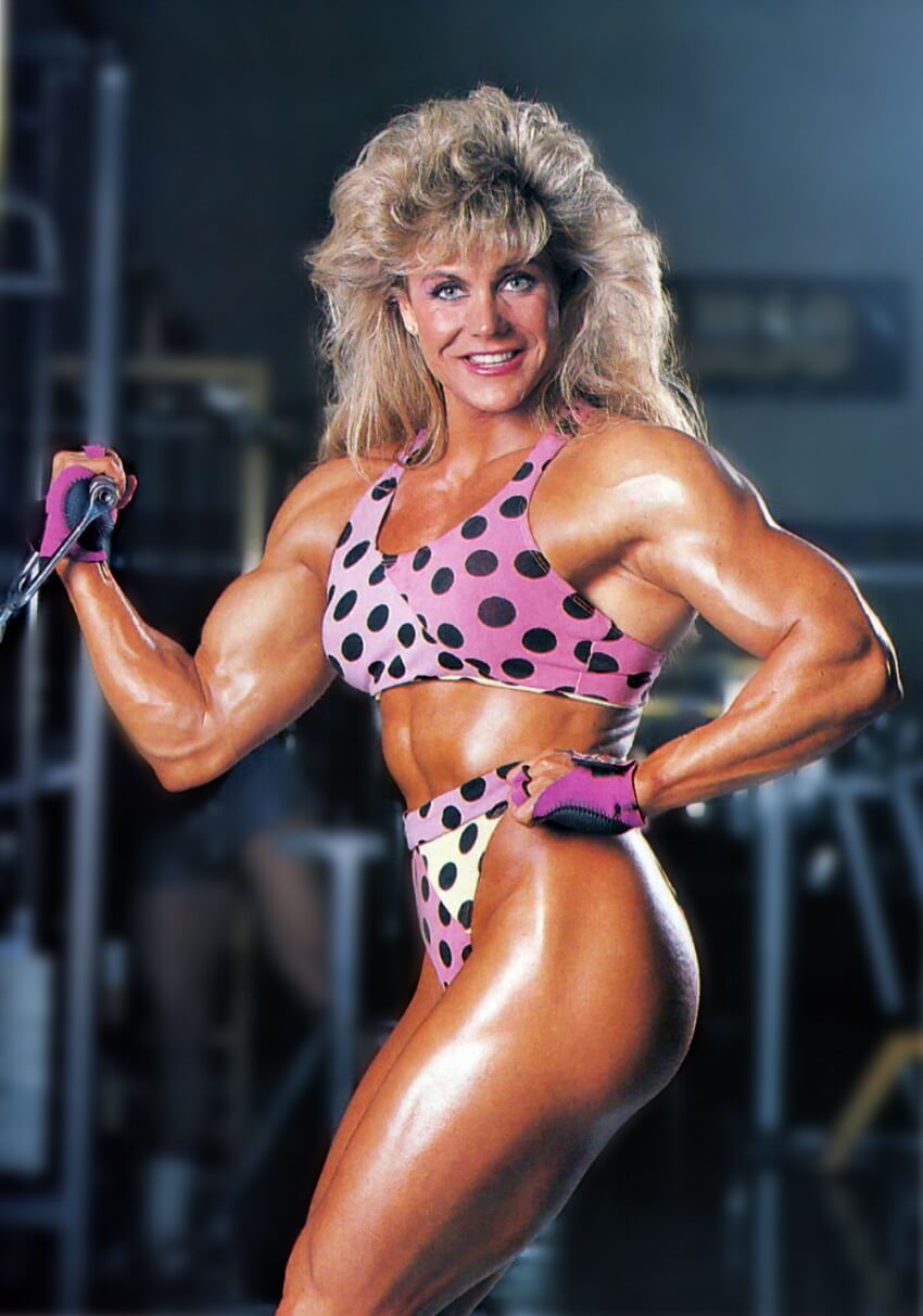 Sandy Riddell flexing her toned and lean physique in the gym