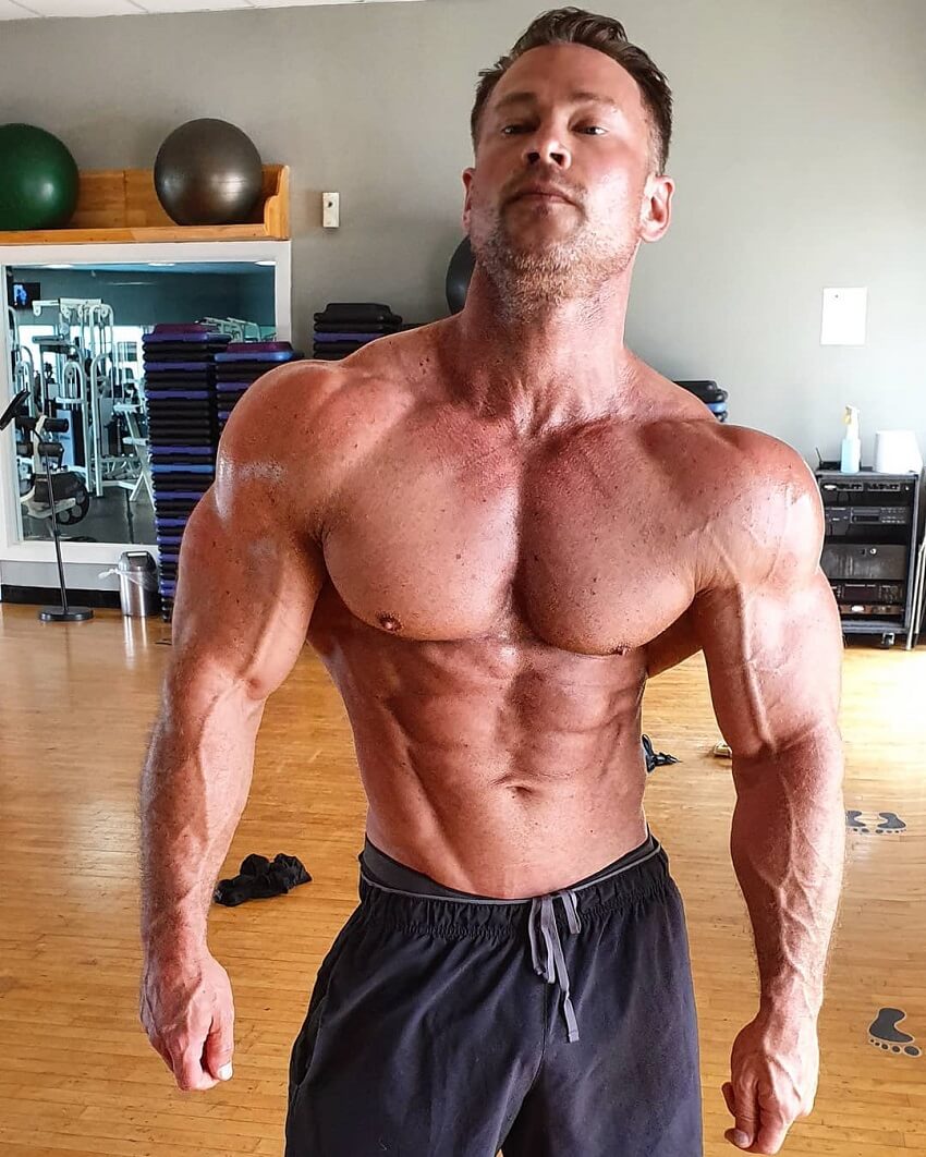 Dan Mazzola posing shirtless looking aesthetic and ripped