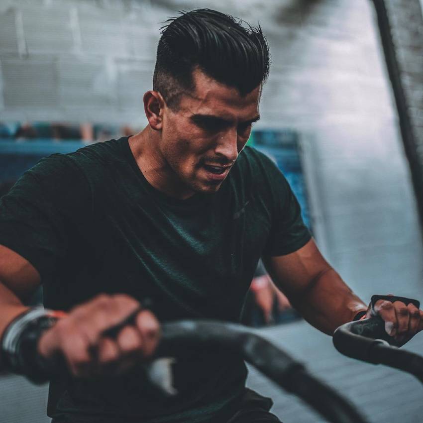 Garret Fisher doing intense training in a CrossFit gym