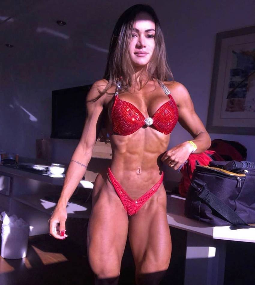 Susana Rodriguez looking ripped and fit in a red bikini
