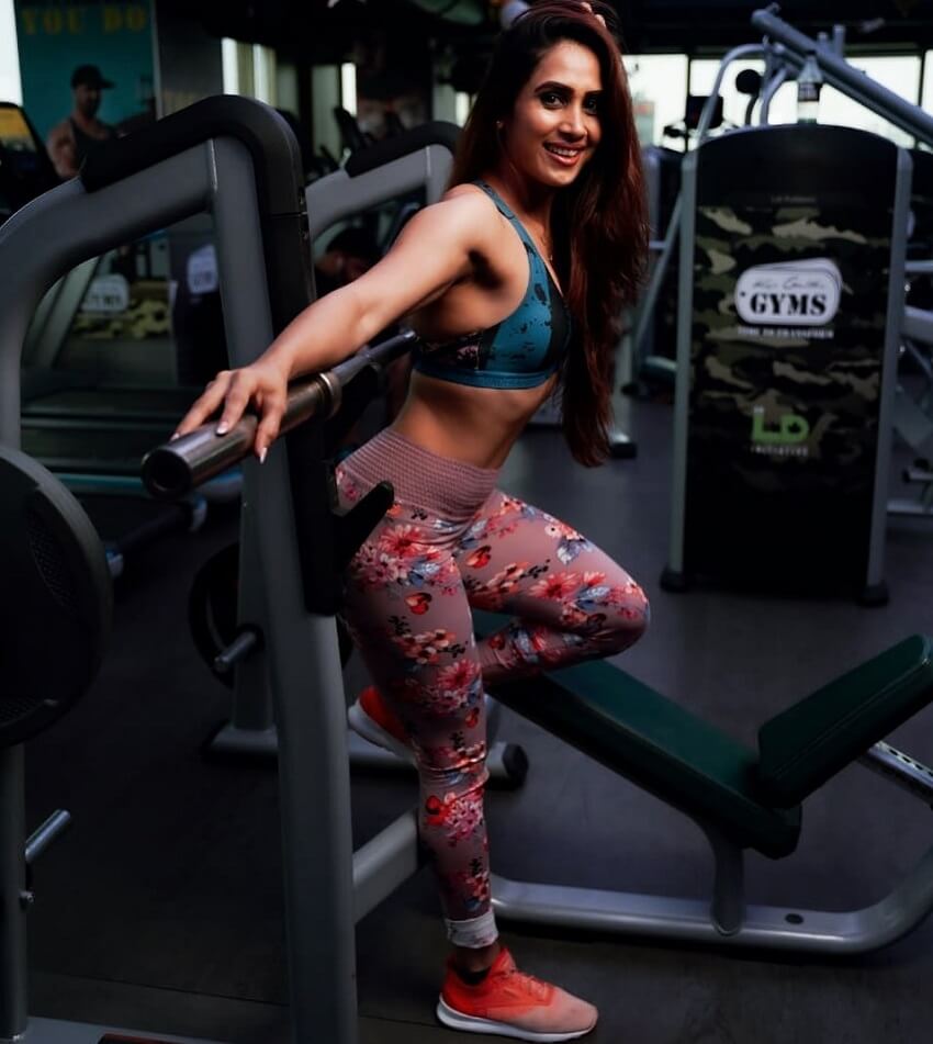 Vaishali Bhoir posing in the gym looking fit and lean