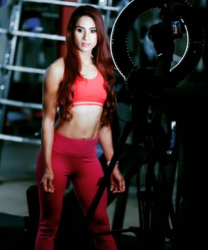 Vaishali Bhoir posing in red dress in a fitness photo shoot